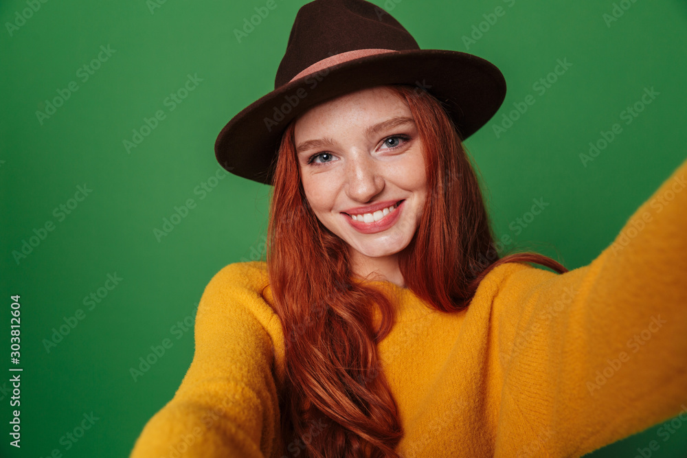 Sticker Redhead woman take a selfie by camera.