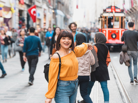 Cute girl shows popular Tramway vehicle in Istanbul