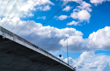 Bottom view of elevated concrete highway. Overpass concrete road. Road flyover structure. Modern...