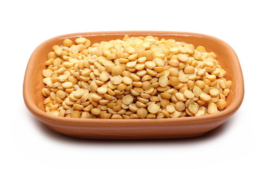Split peas in clay pot,bowl isolated on white background