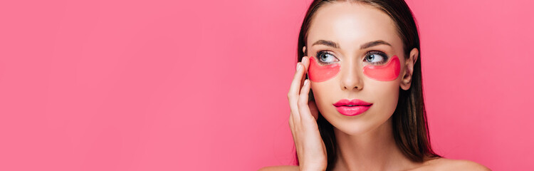 naked beautiful woman touching eye patch on face isolated on pink, panoramic shot