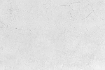 Rough white relief stucco with cracks wall texture background. blank for designers