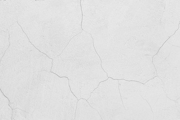 Rough white relief stucco with cracks wall texture background. blank for designers