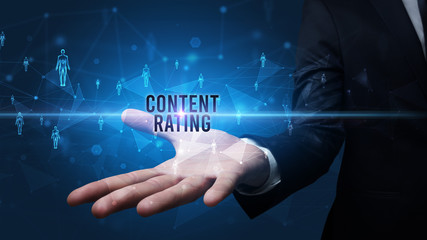 Elegant hand holding CONTENT RATING inscription, social networking concept