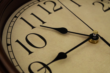 Time passing concept, old vintage clock close up