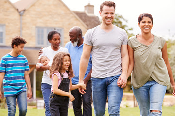 Smiling Multi-Generation Mixed Race Family In Garden At Home Together