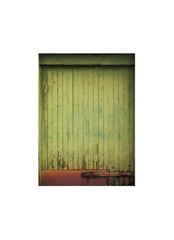 Old rusty green wooden door isolated