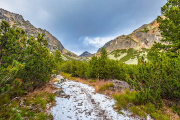 Fototapeta na wymiar Mountain hiking trail in The Mlynicka Valley at late autumn period. The High Tatras National Park, Slovakia, Europe.