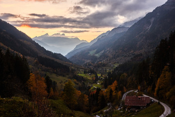 The last rays of the sun illuminate the slope of the Sätteli and the Gadmen valley, seen from the trail to the suspension bridge of Trift (Triftbrücke). Switzerland
