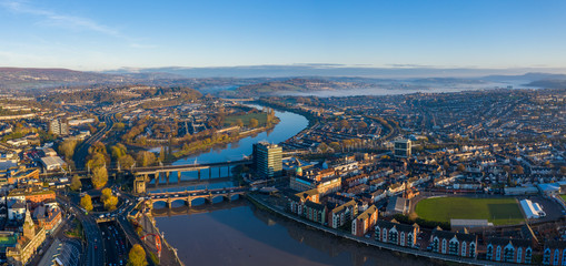 An aerial view at sunrise of Newport city centre, south wales United Kingdom, taken from the River Usk