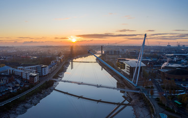 Fototapeta na wymiar An aerial view at sunrise of Newport city centre, south wales United Kingdom, taken from the River Usk
