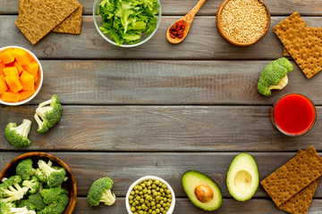 Diet program concept. Set of fresh vegatables and fruits on dark wooden background top view frame copy space