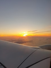 Fototapeta na wymiar Sunset sky on the airplane
