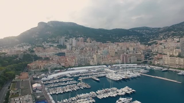 Aerial panoramic view of cityscape of Monte Carlo, yachts in harbor, landscape panorama of Monaco from above, Europe