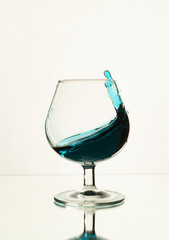 Splash of water in a wine glass