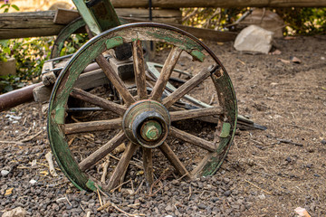 Fototapeta na wymiar Fragment of wheels Old iron black agricultural plow