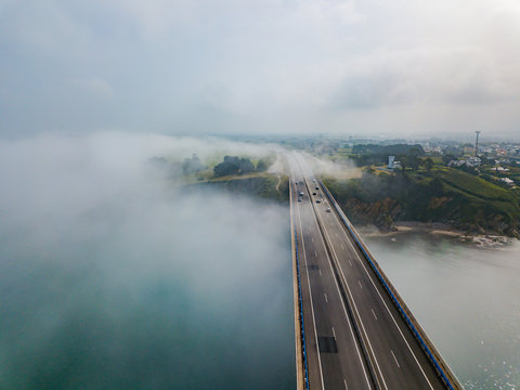 Aerial view on dos Santos bridge during fog and bay. Near Ribadeo in Northern Spain