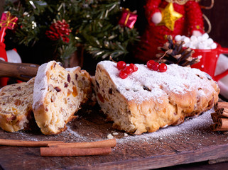 Fototapeta na wymiar Stollen a traditional European cake with nuts and candied fruit