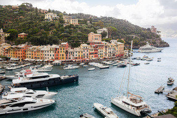 Fototapeta na wymiar View on Portofino. Italian fishing village and holiday resort famous for its picturesque harbour and historical association with celebrity and artistic visitors