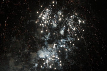 Naklejka na ściany i meble Beautiful view of fireworks in the black sky.