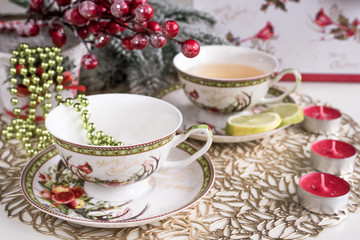 Obraz na płótnie Canvas Christmas composition with flowers and white tea cups