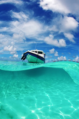 Underwater world Maldives. The boat in the ocean underwater.