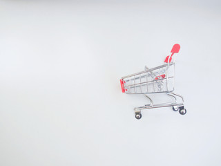 The empty basket of shopping cart is on the white background.   