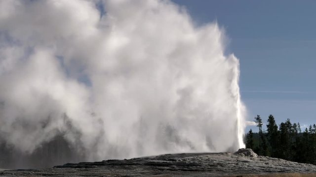 close up of old faithful geyser erupting at yellowstone national park of wyoming, usa