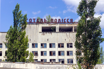 The ruins of residential buildings, the dark trash of collapsed houses as a result of the economic crisis and earthquake. The interior of the old buildings is destroyed. Chernobyl hotel Polissa.