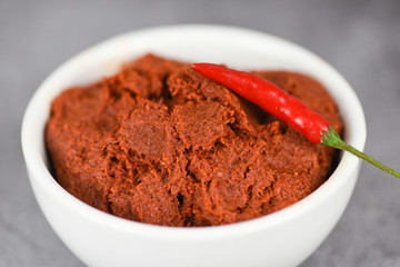 curry paste and red chilli peppers background - ingredients table asian food spicy in thailand