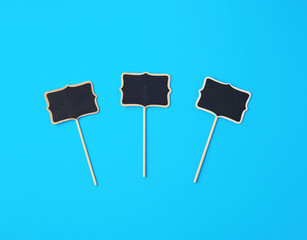 wooden pointer on a stick for writing text, blue background