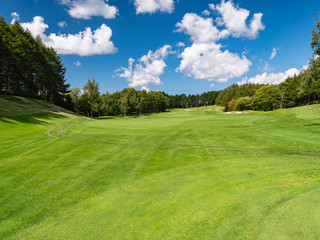 Golf Course with beautiful green field. Golf course with a rich green turf beautiful scenery.