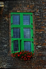 Fototapeta na wymiar interesting windows in old historic tenement houses in the Polish city of Gdansk close up