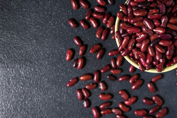 red healthy beans on a dark gray  background
