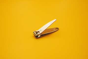 White Nail clipper or Nail cutter on yellow background - obrazy, fototapety, plakaty