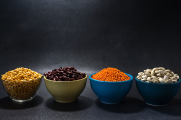  healthy eating vegetarian beans lentils and peas on a dark background