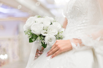 closeup of bride hands holding beautiful wedding bouquet