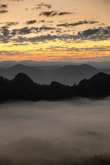 Fototapeta na wymiar mountains under mist in the morning