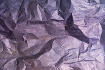 Old crumpled violet paper texture