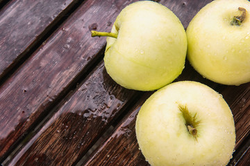 Yellow apples under rain