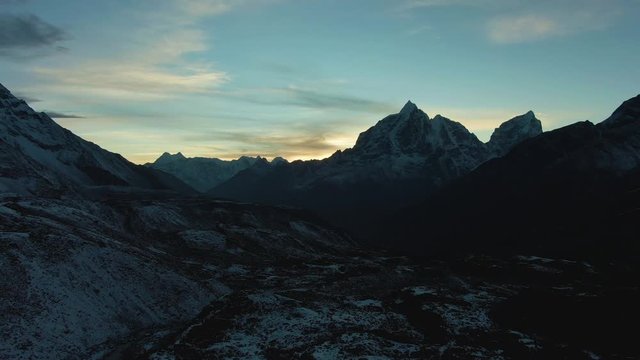 Taboche and Cholatse Mountain at Sunset. Himalaya, Nepal. Aerial View. Drone Flies Forward