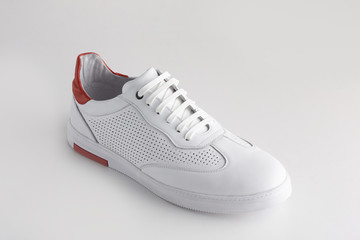 Sports white leather shoes idolated on white background.