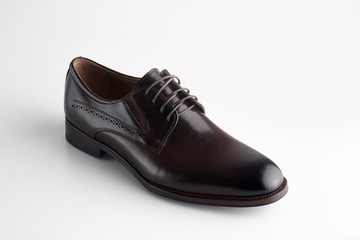 Black men leather shoe with shoelaces on white background