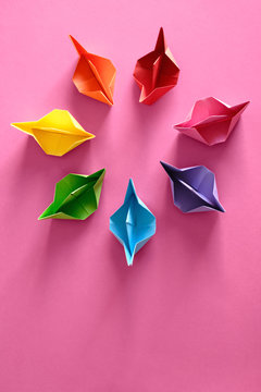 Authentic Origami Boats In Circle On Pink Background