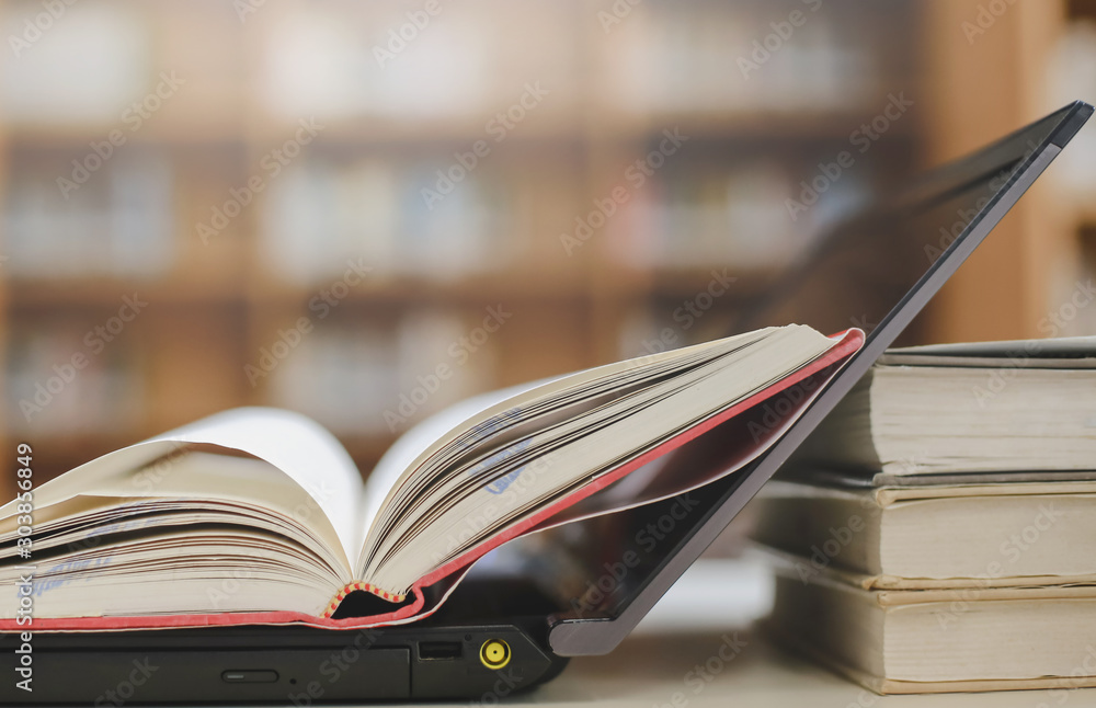 Poster stack of books in the library and blur bookshelf background