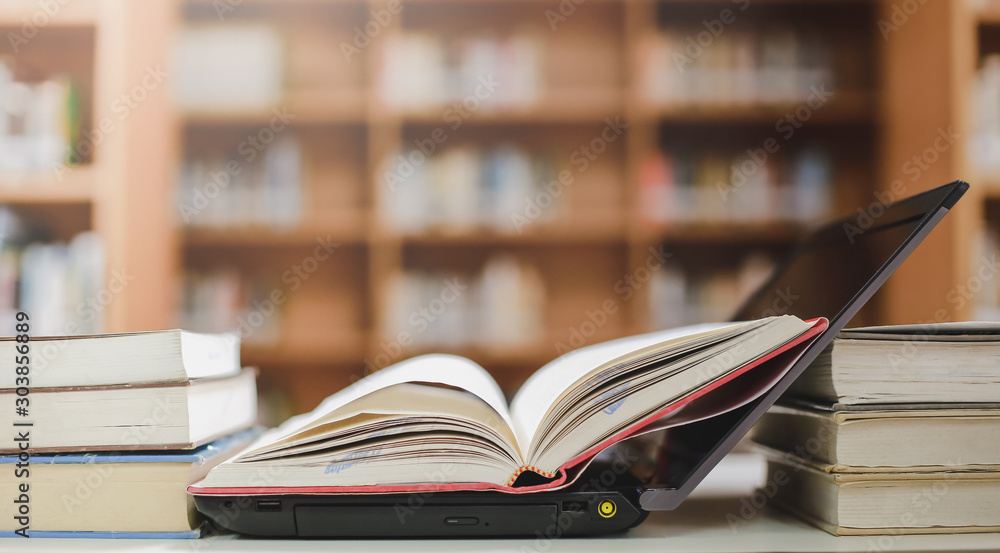 Poster stack of books in the library and blur bookshelf background