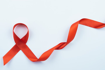 Obraz na płótnie Canvas Aids awareness, red ribbon on white background with copy space for text. World Aids Day, Healthcare and medical concept.