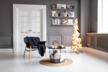 Blurred photo of appartment room in process of preparative decoration for New Year