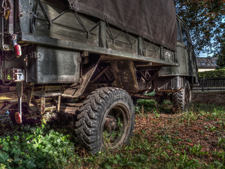 Fototapeta na wymiar old, rusty and dilapidated trucks
