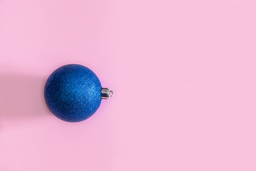 Blue Christmas toy on a yellow background